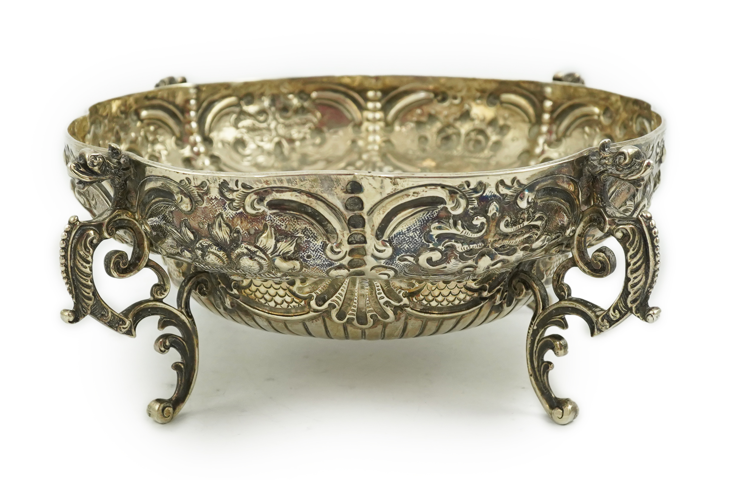 A late Victorian embossed lobed silver bowl, by Goldsmiths & Silversmiths Co Ltd?